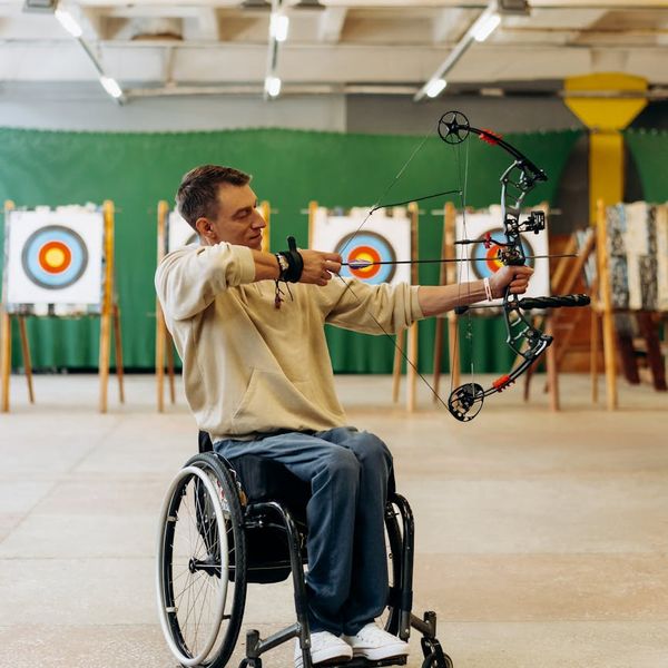 Portrait of a smiling, confident woman in her 30s.
